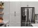 Stainless steel refrigerator with white cabinets at 597 Buttonwood Dr, Longboat Key, FL 34228