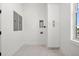 Clean laundry room with a tall storage cabinet and hookups for a washer and dryer at 597 Buttonwood Dr, Longboat Key, FL 34228