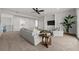 Spacious living room featuring neutral tones and decor, ample seating, and modern lighting at 597 Buttonwood Dr, Longboat Key, FL 34228