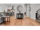 Bright living space with hardwood floors, stylish furnishings, and open access to the modern kitchen in the background at 597 Buttonwood Dr, Longboat Key, FL 34228