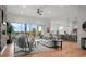 Comfortable living room featuring a large balcony with views of the neighborhood at 597 Buttonwood Dr, Longboat Key, FL 34228