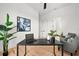 Bright office space featuring a modern black desk, stylish decor, and ample natural light at 597 Buttonwood Dr, Longboat Key, FL 34228
