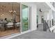 Indoor-outdoor living is enhanced by the sliding doors that lead from the dining area to the patio at 597 Buttonwood Dr, Longboat Key, FL 34228