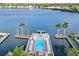 Community dock view features swimming pool, boat slips, nearby landscaping, and plenty of seating at 5970 Midnight Pass Rd # 177, Sarasota, FL 34242