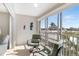 Relaxing balcony with comfortable seating and beautiful views of the surrounding neighborhood at 5970 Midnight Pass Rd # 177, Sarasota, FL 34242