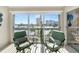 Relaxing balcony seating area with a serene view of the city and lush greenery at 5970 Midnight Pass Rd # 177, Sarasota, FL 34242