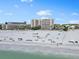 Beachfront condo view features access to white sand, community amenities, and beach goers at 5970 Midnight Pass Rd # 177, Sarasota, FL 34242