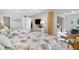 Bedroom featuring two beds, access to the lanai, and light-colored walls at 5970 Midnight Pass Rd # 177, Sarasota, FL 34242