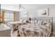 Comfortable bedroom features two beds, a ceiling fan, and beach-themed decor at 5970 Midnight Pass Rd # 177, Sarasota, FL 34242