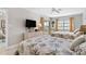 Cozy bedroom featuring two beds, a TV, and access to a private balcony at 5970 Midnight Pass Rd # 177, Sarasota, FL 34242