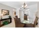 Charming dining area with a glass table and views into the adjacent updated kitchen at 5970 Midnight Pass Rd # 177, Sarasota, FL 34242
