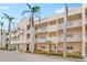 Beautiful multi-story building features balconies, lovely landscaping, and convenient street access at 5970 Midnight Pass Rd # 177, Sarasota, FL 34242
