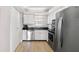The kitchen features stainless steel appliances, white cabinets and plenty of storage space at 5970 Midnight Pass Rd # 177, Sarasota, FL 34242