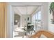 Enclosed lanai featuring two chairs and views of the surrounding community at 5970 Midnight Pass Rd # 177, Sarasota, FL 34242