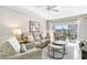 Inviting living room features comfortable seating, stylish decor, and access to a private balcony at 5970 Midnight Pass Rd # 177, Sarasota, FL 34242