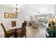 A beautifully staged living and dining area with modern furnishings, light-colored walls, and an open floorplan at 5970 Midnight Pass Rd # 177, Sarasota, FL 34242