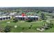 Aerial view of the building with an arrow pointing to the unit; near a golf course at 6120 43Rd W St # 103B, Bradenton, FL 34210