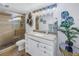 Updated bathroom features a glass enclosed shower, neutral finishes, and modern lighting at 6120 43Rd W St # 103B, Bradenton, FL 34210