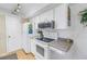 Efficient kitchen with white cabinetry and essential appliances at 6120 43Rd W St # 103B, Bradenton, FL 34210
