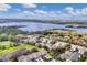 Aerial view of community showcasing a lake, golf course, mature trees and well-maintained landscaping at 6314 Stone River Rd # 6314, Bradenton, FL 34203
