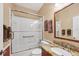 Bathroom with shower, granite countertop, and a large mirror; complete with modern fixtures and ample space at 6314 Stone River Rd # 6314, Bradenton, FL 34203