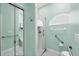 Bathroom featuring glass enclosed shower with safety handrails, accessible toilet and grab bars for safety and convenience at 6314 Stone River Rd # 6314, Bradenton, FL 34203