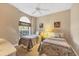 Comfortable bedroom featuring twin beds, neutral decor, a large window, and a calming atmosphere for restful sleep at 6314 Stone River Rd # 6314, Bradenton, FL 34203