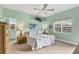 Inviting bedroom with ceiling fan, soft green walls, and peaceful ambiance at 6314 Stone River Rd # 6314, Bradenton, FL 34203