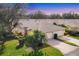 Beautifully landscaped property with a well-maintained lawn and mature trees, showcasing the home's curb appeal at 6314 Stone River Rd # 6314, Bradenton, FL 34203