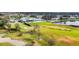 Expansive golf course featuring rolling greens, a clubhouse, sand traps, and scenic views of the surrounding community at 6314 Stone River Rd # 6314, Bradenton, FL 34203