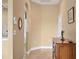 Inviting foyer with wood-look tile flooring, a decorative console table, and seamless transition into other living spaces at 6314 Stone River Rd # 6314, Bradenton, FL 34203