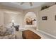 Cozy living space featuring neutral tones, a decorative archway, and seamless transition into the dining and kitchen areas at 6314 Stone River Rd # 6314, Bradenton, FL 34203