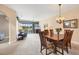 Spacious living room with comfortable seating, a ceiling fan, and a view to the outdoor patio at 6314 Stone River Rd # 6314, Bradenton, FL 34203