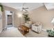 Inviting sunroom with ceiling fan, cozy seating, and a sliding door leading to an outdoor area for relaxation at 6314 Stone River Rd # 6314, Bradenton, FL 34203
