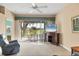Bright living room with comfortable seating, a TV, and sliding glass doors leading to a patio with golf course views at 6314 Stone River Rd # 6314, Bradenton, FL 34203