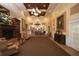Elegant lobby with fireplace, chandelier, seating, and decorative accents at 6314 Stone River Rd # 6314, Bradenton, FL 34203