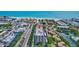 Aerial view of building near beach, water, restaurants, and retail at 6415 Midnight Pass Rd # 211, Sarasota, FL 34242