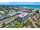 Wonderful aerial view of the property close to waterfront and a marina at 6415 Midnight Pass Rd # 211, Sarasota, FL 34242