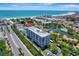 Fantastic aerial view of this waterfront building with boat docks on a clear blue water canal at 6415 Midnight Pass Rd # 211, Sarasota, FL 34242