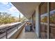Spacious balcony featuring chairs and views of the surrounding area at 6415 Midnight Pass Rd # 211, Sarasota, FL 34242