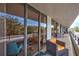 Relax on this spacious balcony with ample seating, offering an inviting outdoor living space at 6415 Midnight Pass Rd # 211, Sarasota, FL 34242