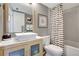 Bathroom featuring a vessel sink, modern fixtures, and a shower/tub combination with stylish black and white shower curtain at 6415 Midnight Pass Rd # 211, Sarasota, FL 34242