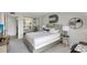 Bright bedroom featuring a mirrored closet, contemporary decor, and neutral colors at 6415 Midnight Pass Rd # 211, Sarasota, FL 34242