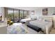 Bright bedroom with balcony access and two twin beds at 6415 Midnight Pass Rd # 211, Sarasota, FL 34242