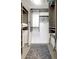 Walk-in closet with custom shelving and hanging storage for optimal organization and functionality, with a shag rug at 6415 Midnight Pass Rd # 211, Sarasota, FL 34242