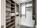 Walk-in closet featuring shelving and hanging storage at 6415 Midnight Pass Rd # 211, Sarasota, FL 34242