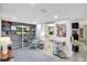 Cozy living room features open shelving, modern decor, and easy access to the kitchen at 6415 Midnight Pass Rd # 211, Sarasota, FL 34242