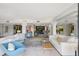 Expansive living room featuring stylish decor, including contemporary furnishings, colorful accents, and bright, open space at 6415 Midnight Pass Rd # 211, Sarasota, FL 34242