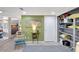 Inviting living room with colorful accents, open shelving, and easy access to the kitchen at 6415 Midnight Pass Rd # 211, Sarasota, FL 34242