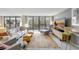 Bright living room features a sliding glass door to a balcony, offering natural light and beautiful outdoor views at 6415 Midnight Pass Rd # 211, Sarasota, FL 34242